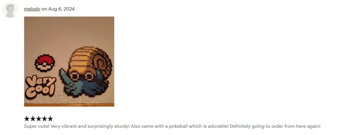 An Etsy review for the Pokémon Omanyte made out of Perler beads. The review is 5-stars and reads: Super cute! Very vibrant and surprisingly sturdy! Also came with a pokeball which is adorable! Definitely going to order from here again!